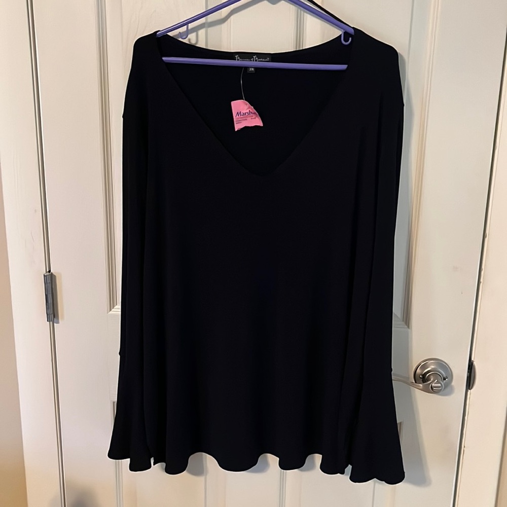 Black shirt  with ruffled end sleeves.
